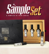 Set of perfume samples with a black and gold box on a red background, featuring 'Sample Set' branding.