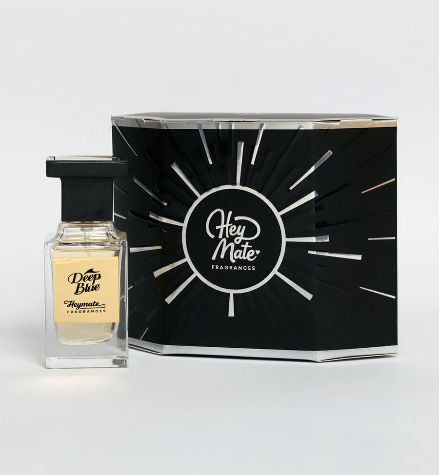 Perfume bottle labeled 'Deep Blue' by HeyMate Fragrances with its packaging on a white background