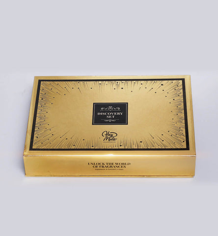Gold and black fragrance discovery set box on a white background