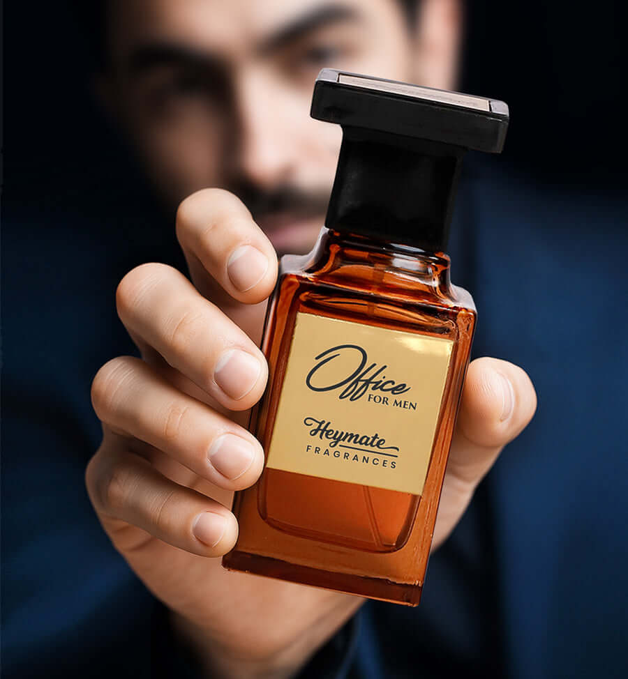 Hand holding a perfume bottle labeled 'Office for Men' by Heymate Fragrances