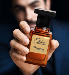 Hand holding a perfume bottle labeled 'Office for Men' by Heymate Fragrances