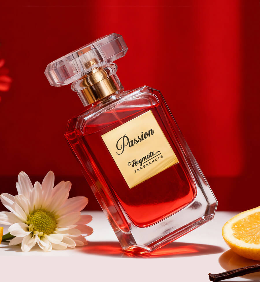 Perfume bottle labeled 'Passion' by Heymata Fragrances with a red liquid, white flower, and orange slice on a red background.