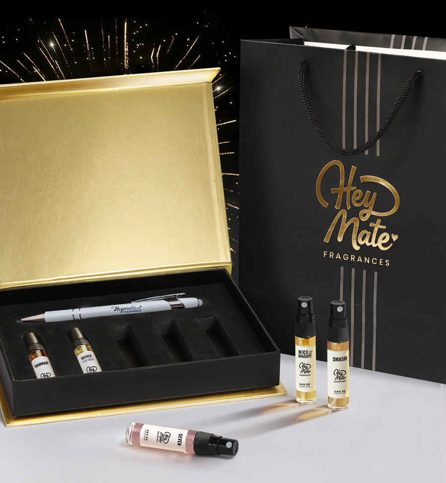 HeyMate Fragrances packaging including a black gift box, white pen and bottle set on a white background.