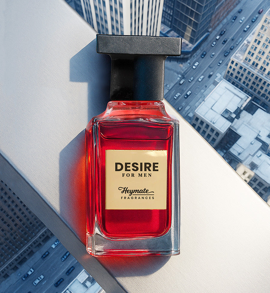 Red perfume bottle labeled 'Desire for Men' by Heymate Fragrances on a cityscape background