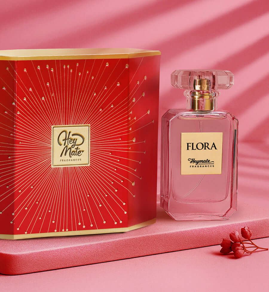 Flora perfume bottle with red packaging on a pink background