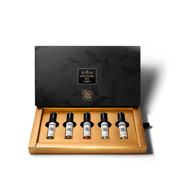 Set of five small bottles in a decorative black and gold box with 'Discovery Set - Heymate' branding.