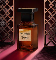 Perfume bottle labeled 'Oud Magic' by Heymate Fragrances against a decorative background