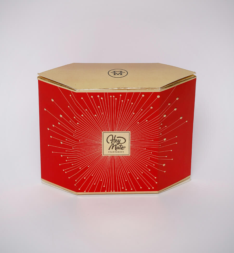 Red hexagonal box with gold accents on a white background